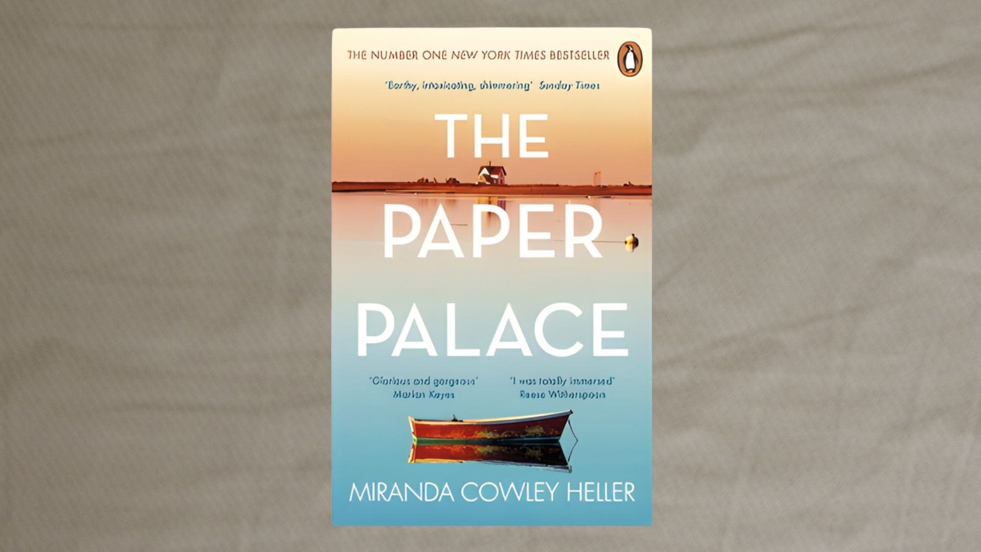 Cover of "The Paper Palace" by Miranda Cowley Heller, featuring a sunset over water with a small boat, evoking a serene and reflective mood.