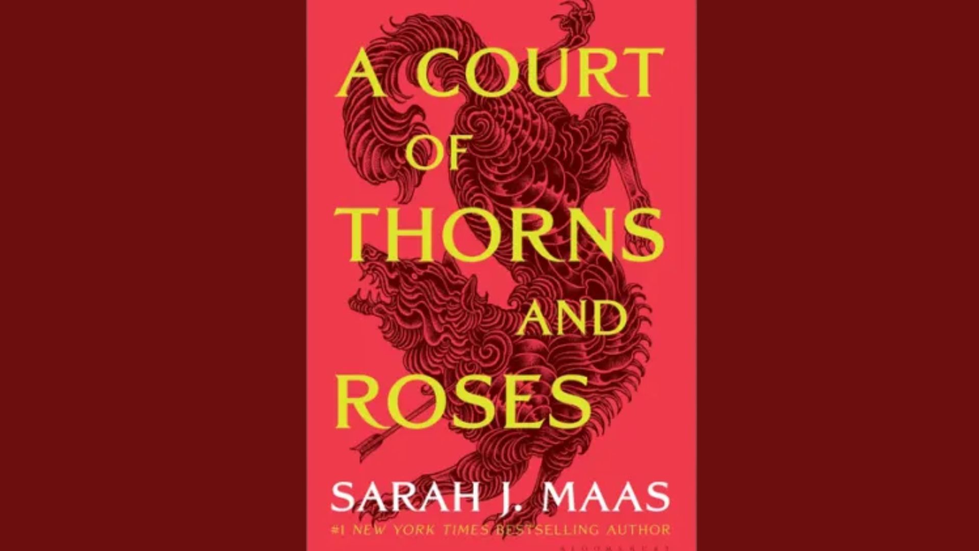 Book cover of "A Court of Thorns and Roses" with bold yellow title text on a red background. Intricate black rose and thorn design adds a dramatic tone.