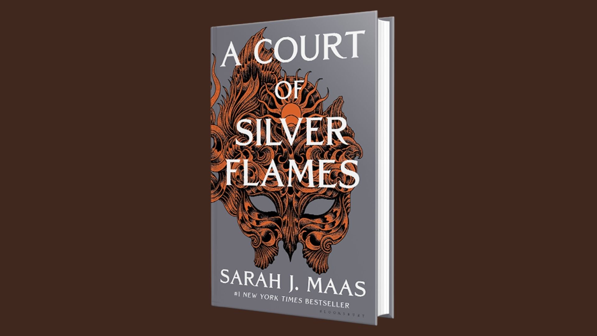 Cover of "A Court of Silver Flames" by Sarah J. Maas, featuring a fiery design with silver and gold hues.