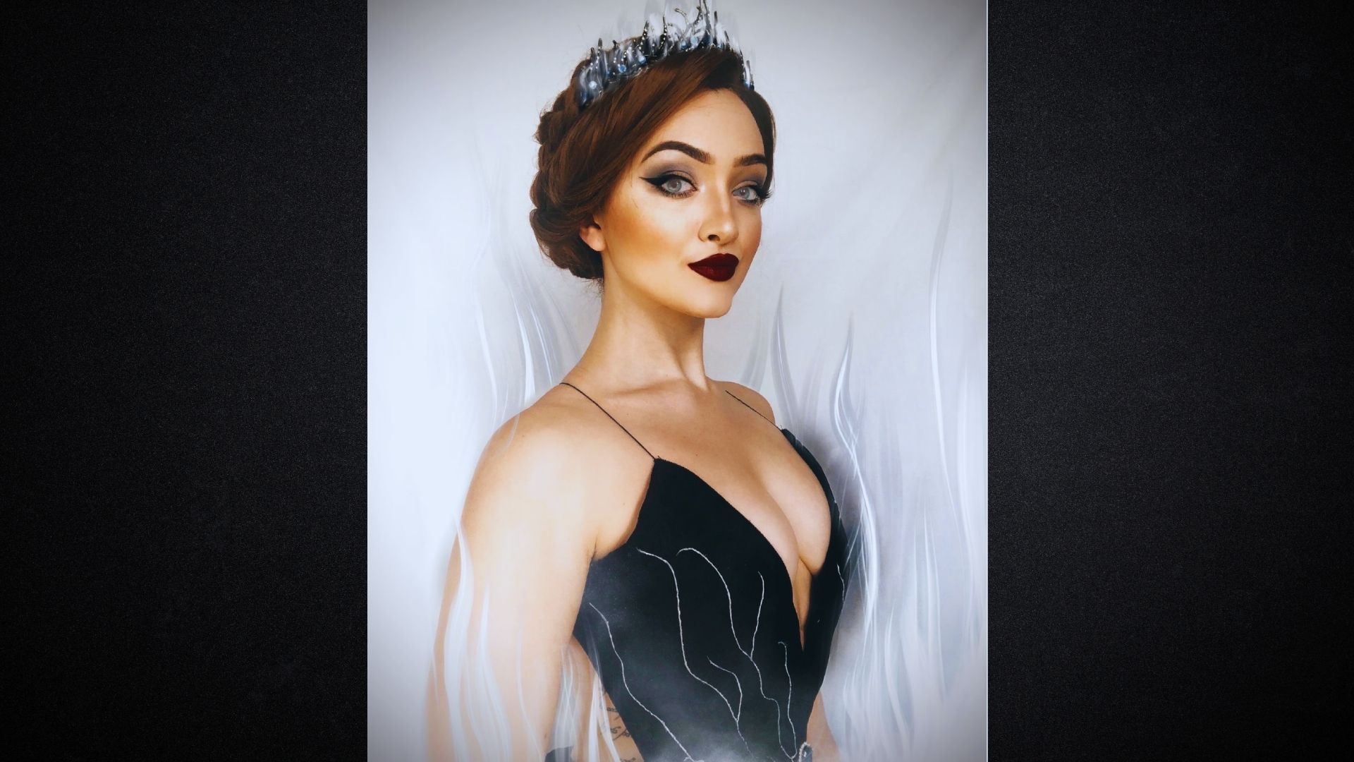 A painting depicting a woman elegantly dressed in a flowing black dress, set against a soft, muted background.