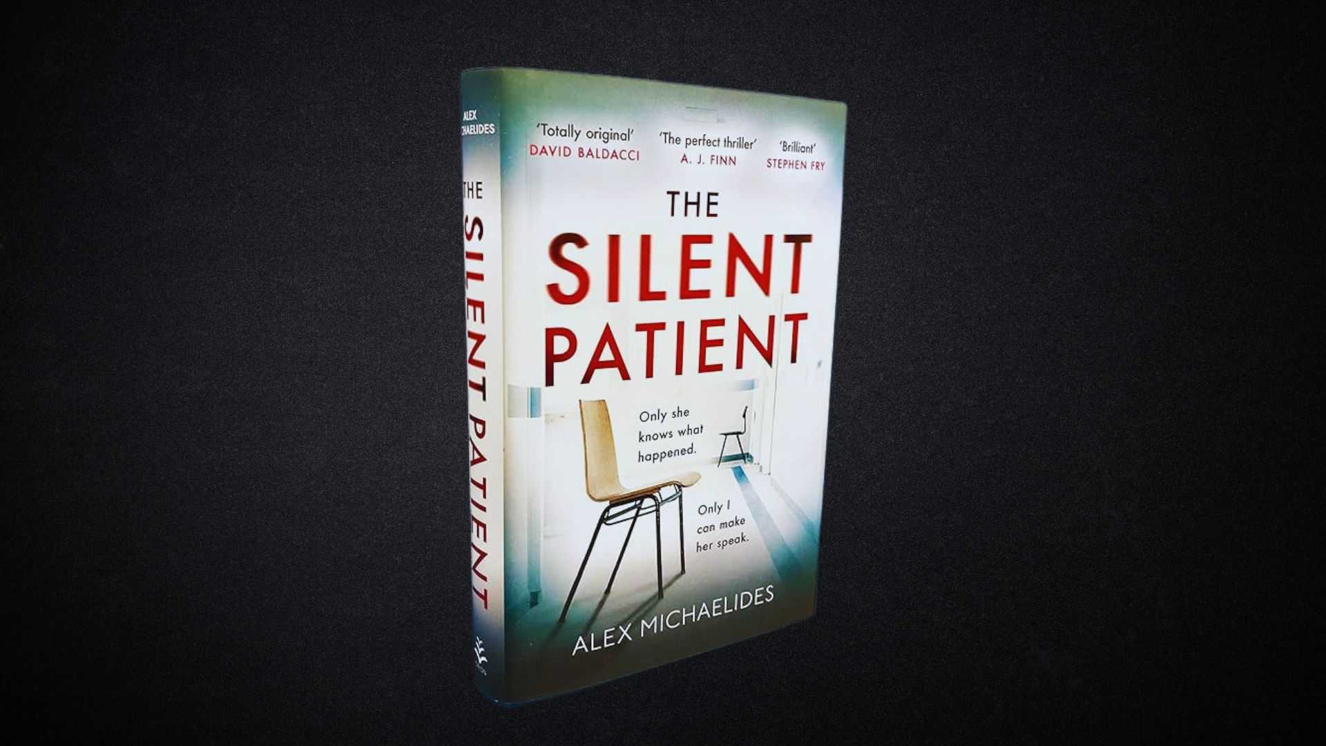 Alt text: "Book cover of 'The Silent Patient' by Alex Michaelides, featuring a solitary chair facing a table, creating a suspenseful and mysterious tone."