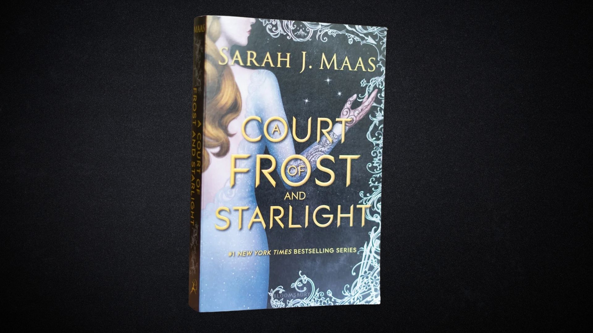 Book cover of "Court Frost and Starlight" by Marah James, featuring a mystical winter landscape with stars and frost.