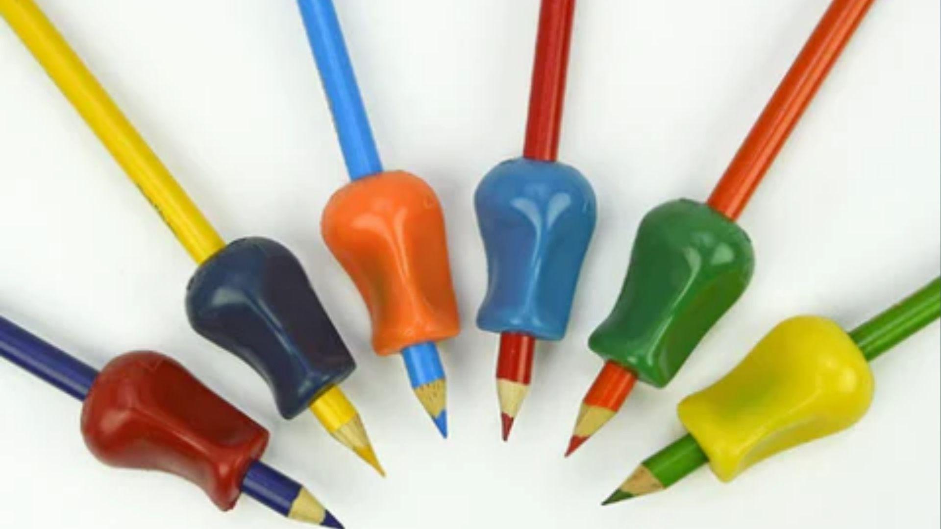 Colorful pencil grips on pencils in a fan shape, teaching proper finger placement for control.