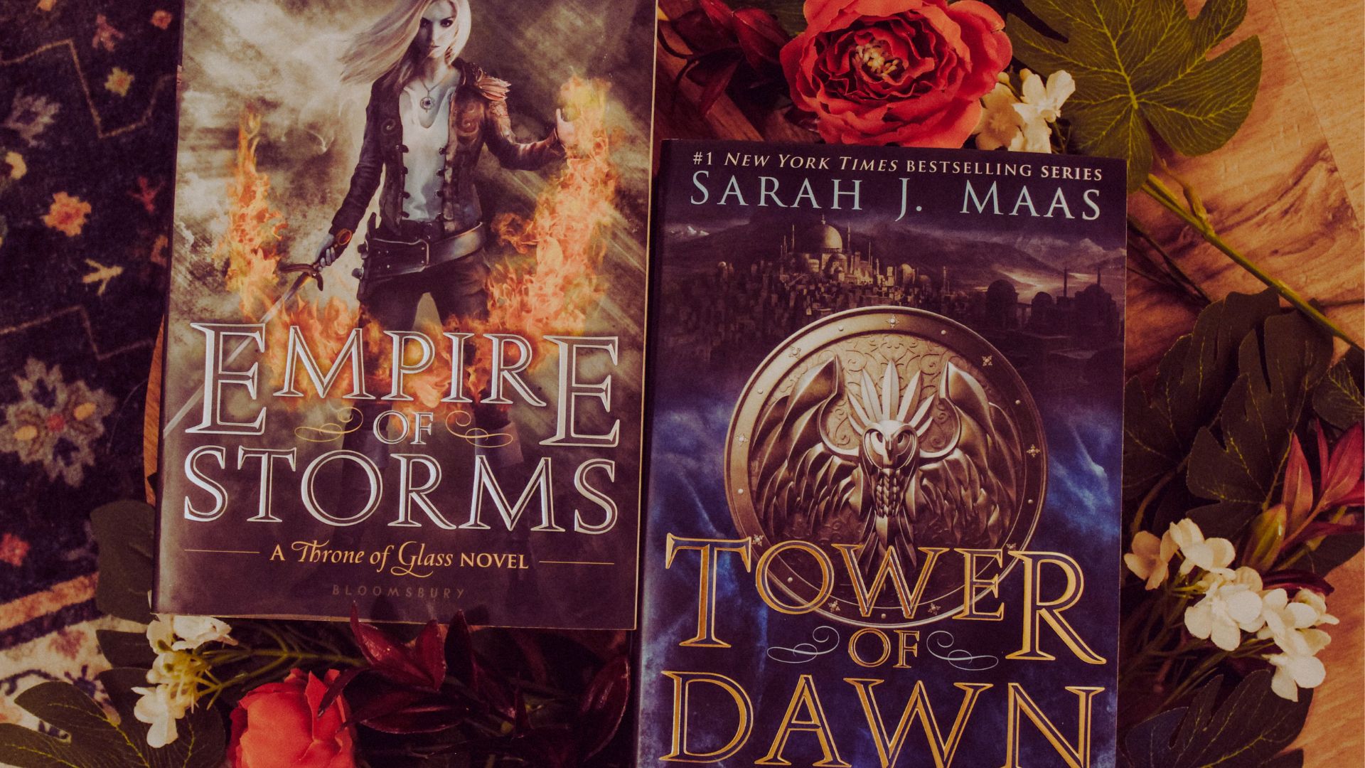 "Cover images of 'Empire of Storms' and 'Tower of Dawn' books, featuring fantasy themes and vibrant artwork."