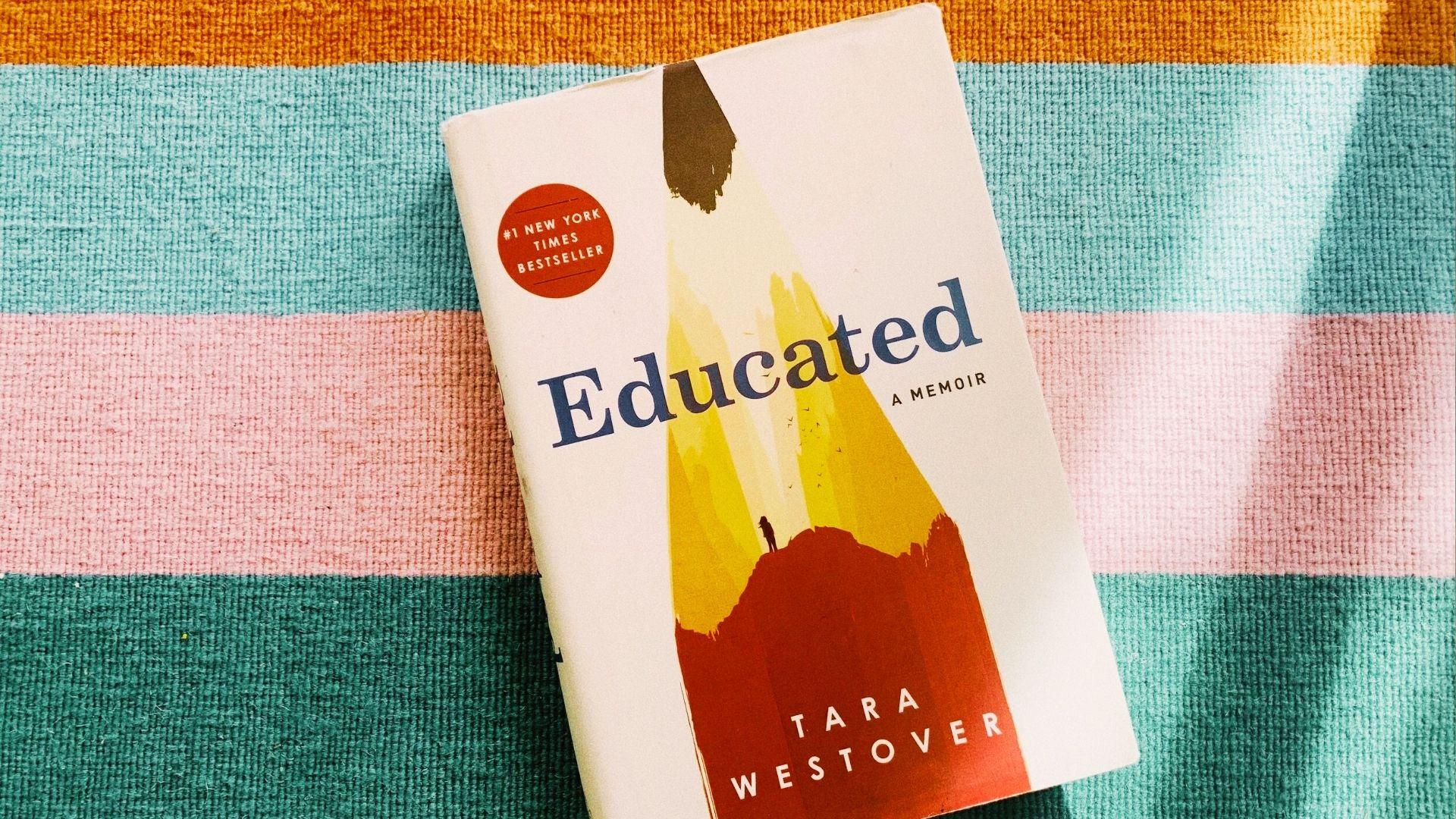 Book cover of "Educated" by Tara Westover, featuring a young woman standing in a mountainous landscape, looking contemplative.