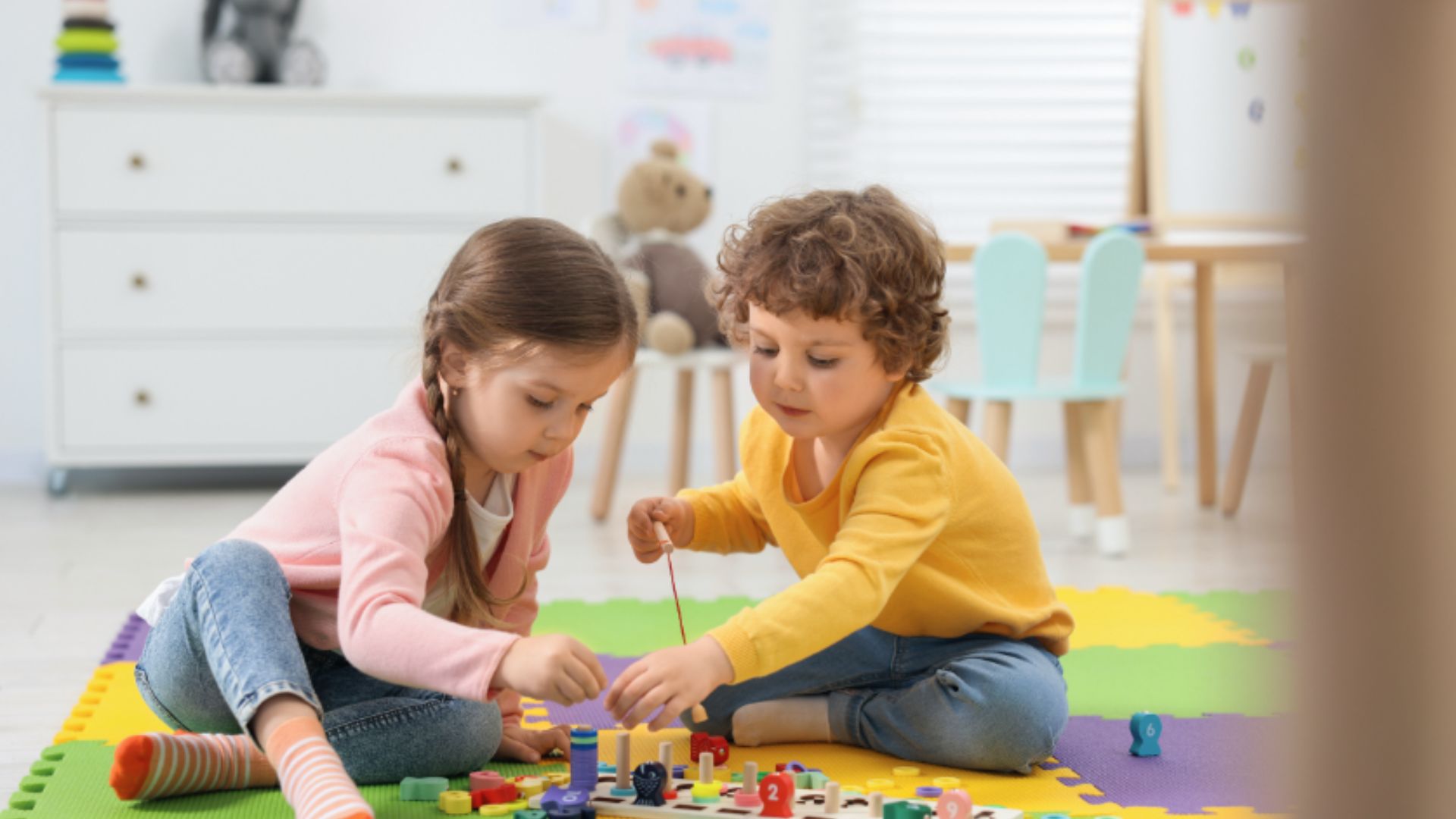 Two children play together with a colorful counting board, sorting pegs and number pieces.