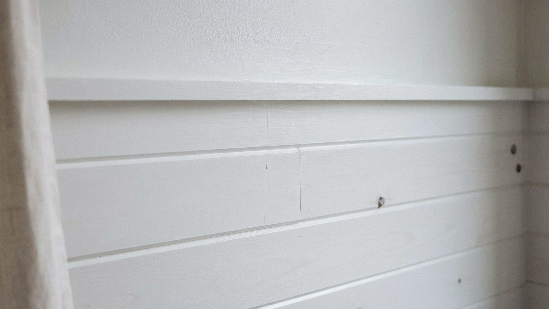 Close-up of shiplap boards showing the overlapping design and texture.