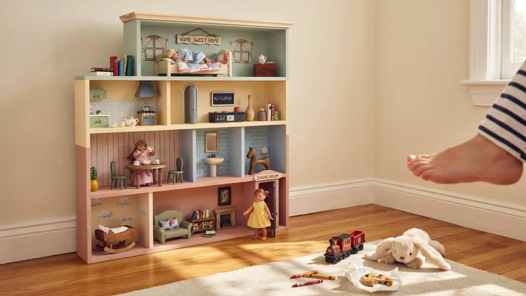 Bookshelf turned into dollhouse with painted rooms.