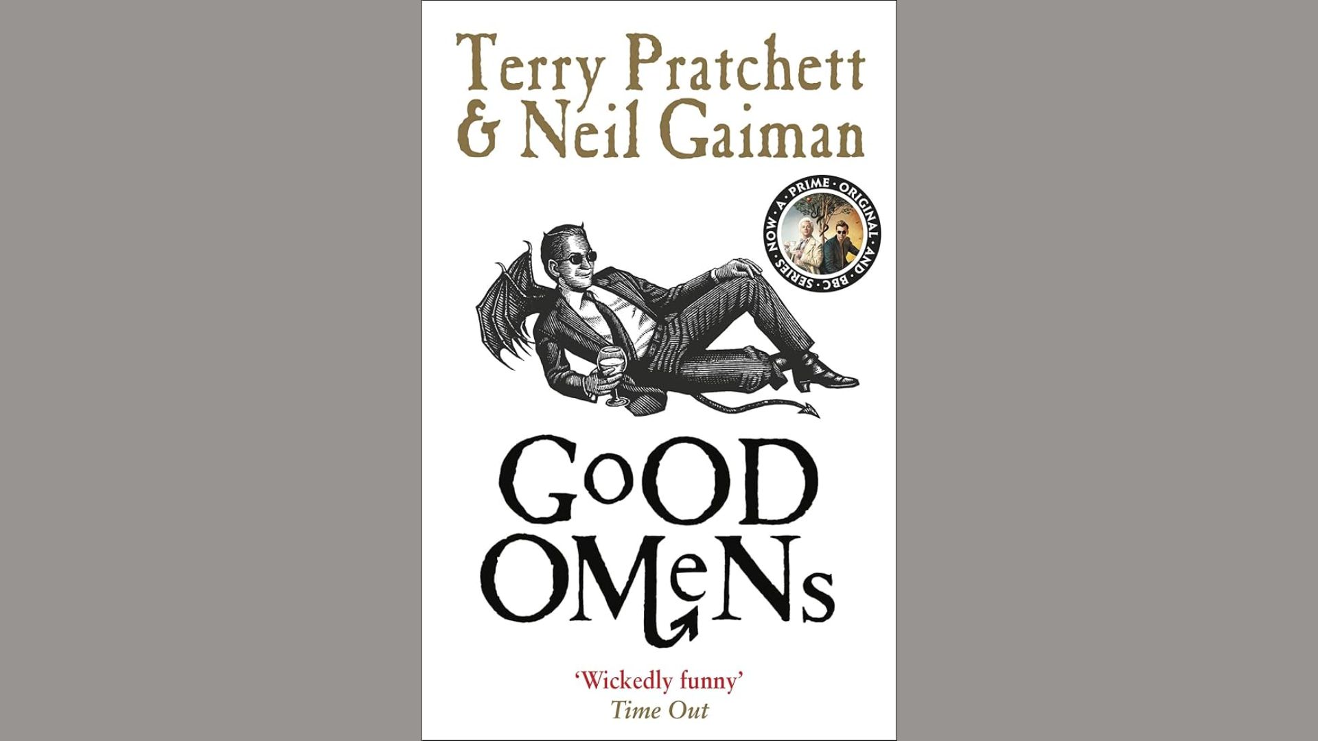 "Cover of 'Good Omens' by Terry Pratchett and Neil Gaiman, featuring whimsical artwork of an angel and demon."