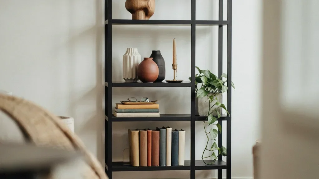 Bookshelf combining books with decor in different textures and shapes.