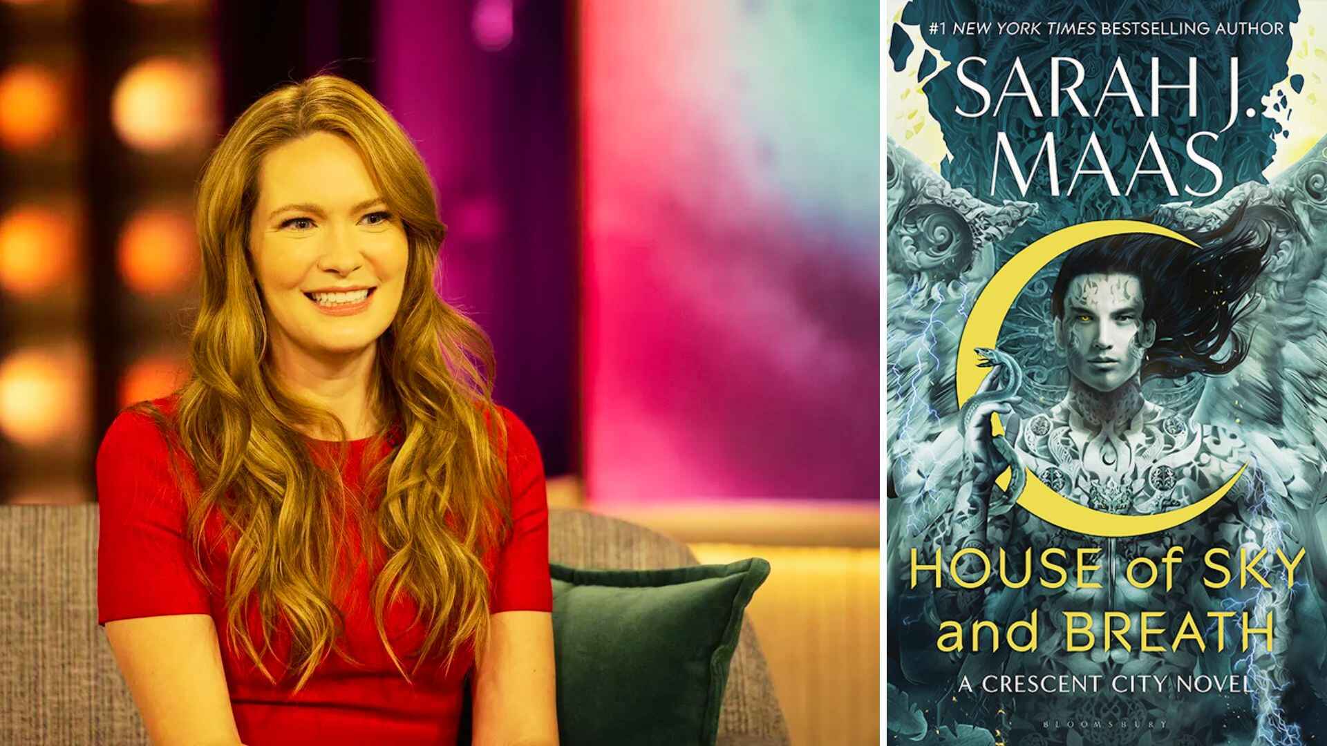 Smiling blonde woman in a red dress on a talk show set next to House of Sky and Breath by Sarah J. Maas book cover.