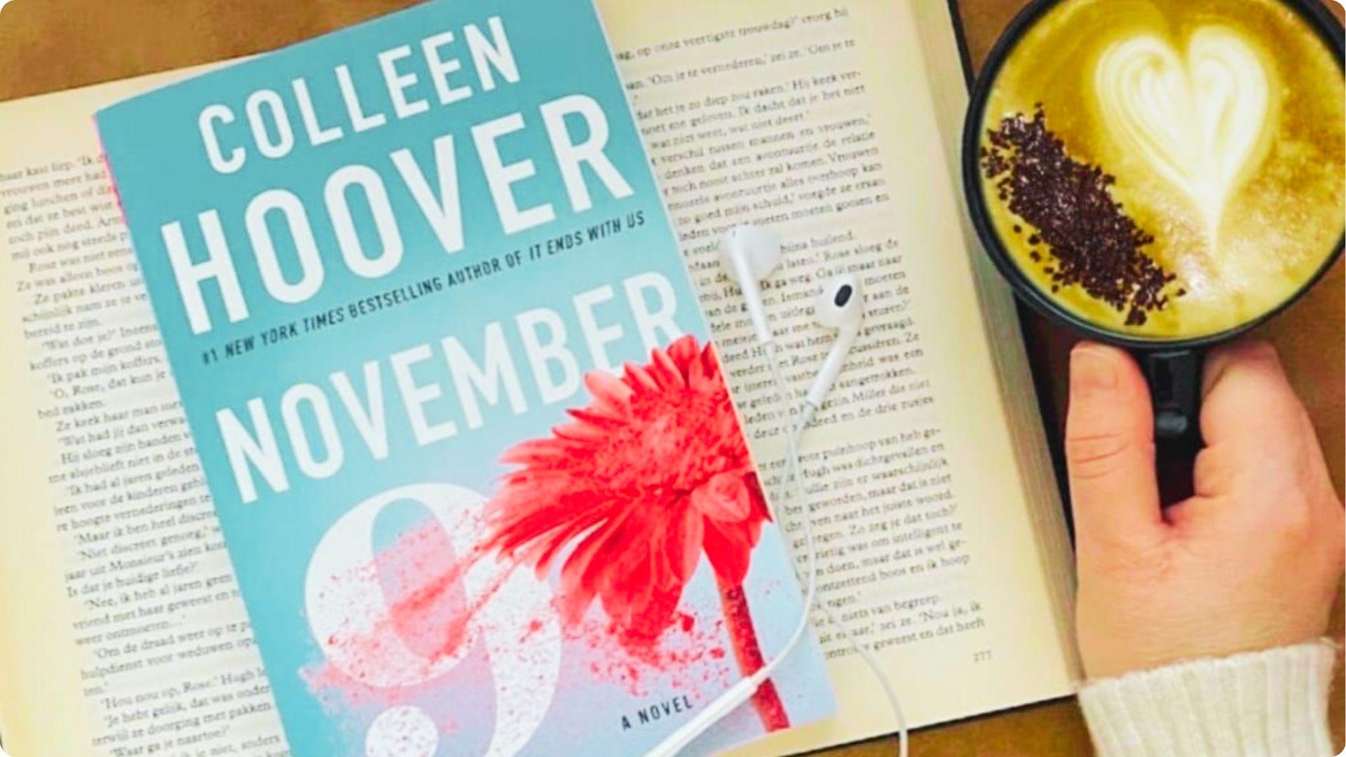 Flat lay of November 9 by Colleen Hoover with a blue cover and red flower, placed on an open book.